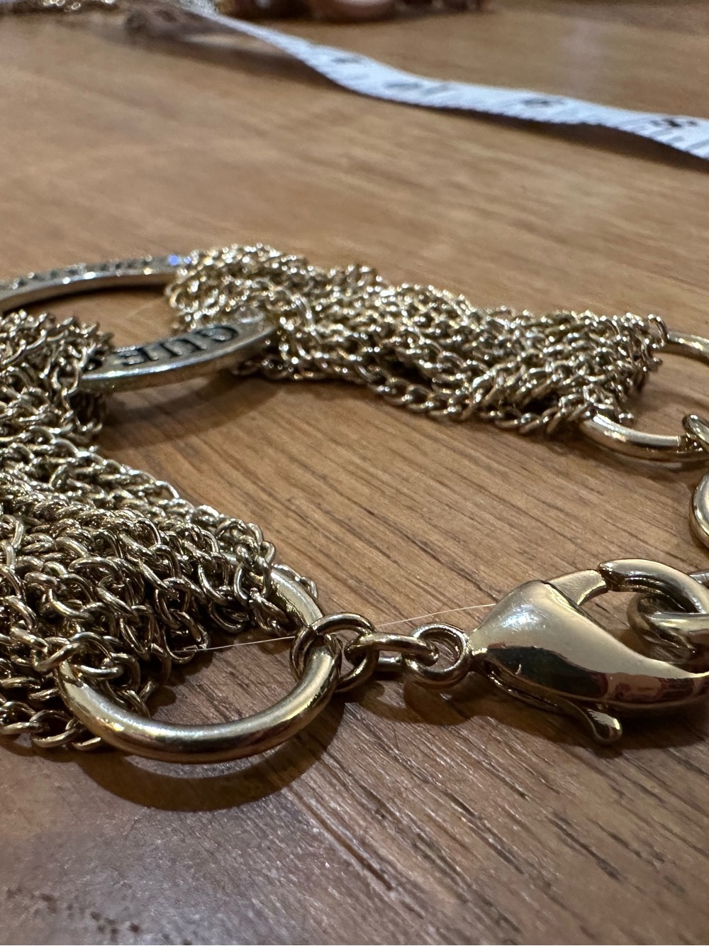 GUESS Gold-Tone Multi-Chain Logo Ring Bracelet with Crystal Accents - Picture 5 of 8